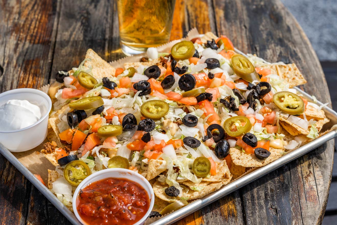 a plate of loaded nachos
