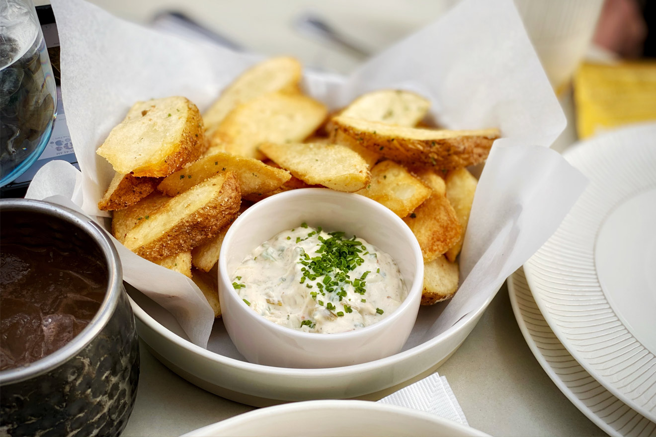 a bowl of onion dip and potatoes
